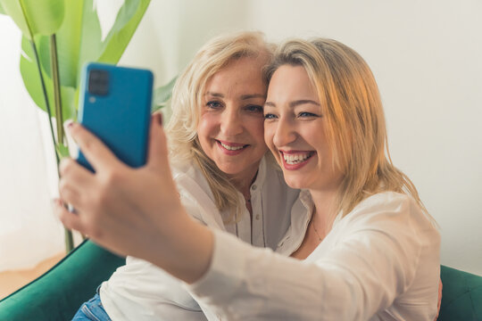 Mother and Daughter make selfie together. High quality photo