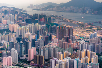 Aerial view of the skyline of the city of Hong Kong and mountains on the horizon, China