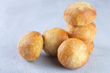 Corn and cheese bread, displayed on gray background