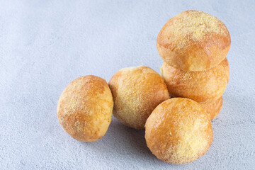 Corn and cheese bread, displayed on gray background