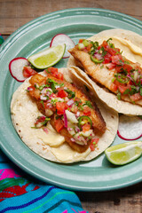 Fish tacos with fresh sauce and mayonnaise. Mexican food