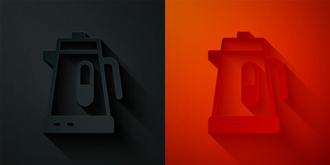 Paper cut Electric kettle icon isolated on black and red background. Teapot icon. Paper art style. Vector