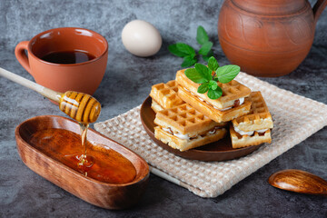 Breakfast with Belgian waffles, honey and coffee
