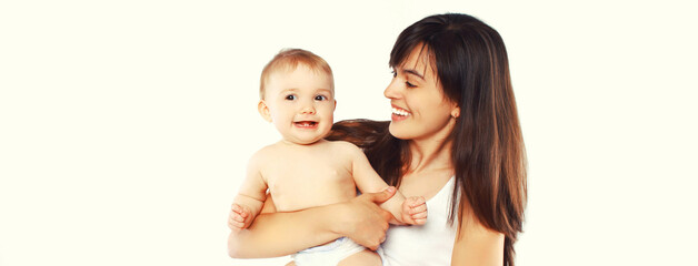 Portrait of happy smiling mother and baby playing together on white background