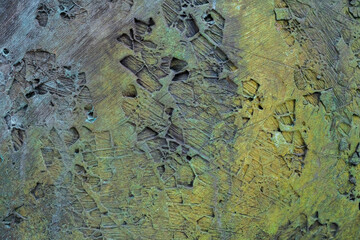 background of a rusty metallic rough surface with ocher colors and trace patterns.