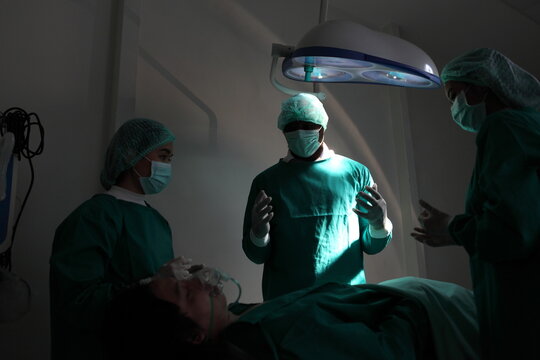 Medical team performing surgery. Group of surgeons in hospital operation theater. Doctor team  medical their success