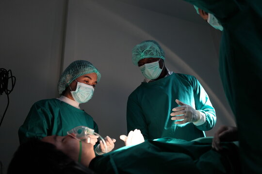 Medical team performing surgery. Group of surgeons in hospital operation theater. Doctor team  medical their success