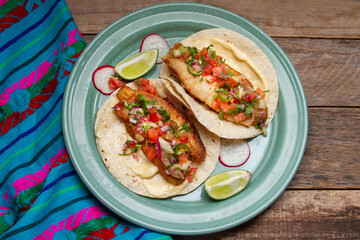 Fish tacos with fresh sauce and mayonnaise. Mexican food