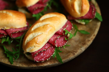 Selective focus. Salami sandwiches with herbs and mustard.