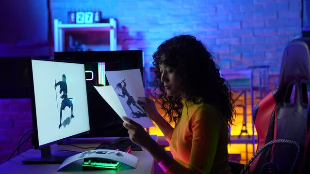 Business concept of 4k Resolution. Asian female designer working in office. Designing clothes and characters in online games.