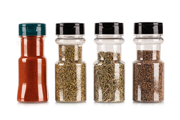  Bottle with different spices and herbs isolated on white background.