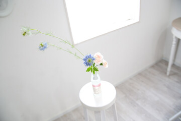 Ikebana flower arrangement in white room in Japan