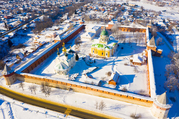 Scenic aerial view of architectural complex of medieval fortified Zaraysk Kremlin on sunny winter day, Russia