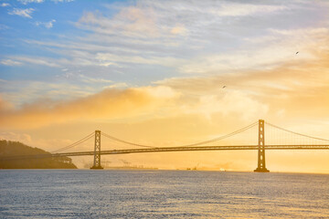 View of Oakland Bay Bridge with sunrise colors in San Francisco, California