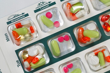 Medication bubble packs, blister cards pharmacy generated compliance packaging to organize medications doses up to four times a day.  Used by patients with complicated dosing - obrazy, fototapety, plakaty