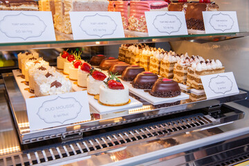 Showcase with sweet cakes and pastries