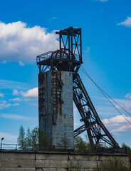 Fototapeta na wymiar A coal mine coper against a cloudy sky