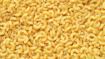 Uncooked elbow macaroni pasta background