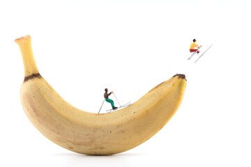 Miniature creative ski workout on banana