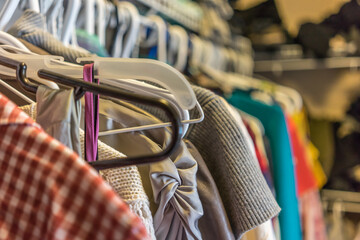 Clothes hanging in a wardrobe at home