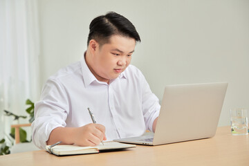 Fototapeta premium A moment of business man work at home with laptop in living room 