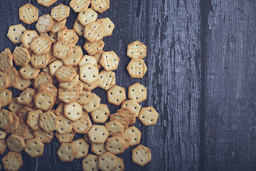 Crispy baked salted biscuits  on wooden table
