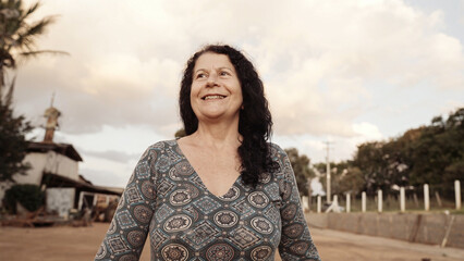 Smiling latin Brazilian woman in the farm. Joy, positive and love.