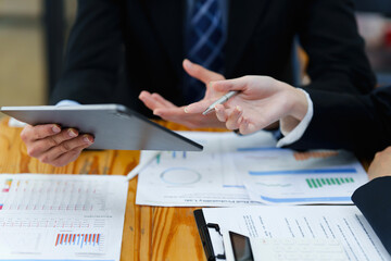 Group of IT consultant working by digital tablet and management big data and analyze financial document of company.