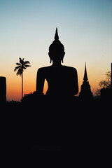 Sunset at Wat Mahathat buddha and temple in Sukhothai Historical Park