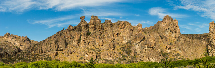 Fototapeta premium Valley with rocky formation of mountains with ancient erosions