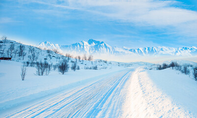 Obraz premium Beautiful winter landscape with snow and ice covered road - Tromso, Norway - Arctic landscape