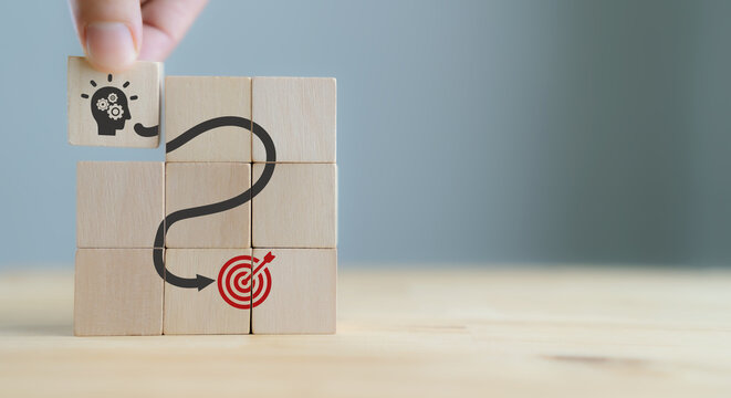 Business mindset and success concept. Growth and personal development. Believing in yourself matters. New mindset new results. Placing wooden cubes with changing personal mindset for goal achievement.