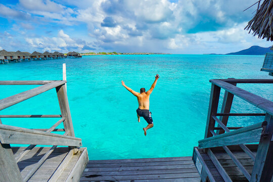 Person Jumping Into Ocean Bora Bora