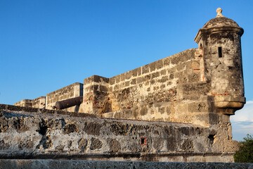 Turret and a cannon on the historic wall in Cartagena, Colombia © Dandrewp/Wirestock Creators