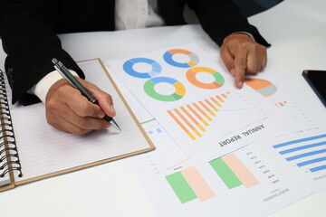 businessman working on laptop with report graph, close up of hands of business man