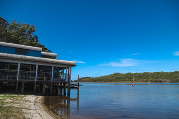 Smith's Lake, NSW Australia: Sail boat on the lake with vibrant rainbow sail