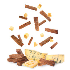 Falling rye croutons with cheese on white background