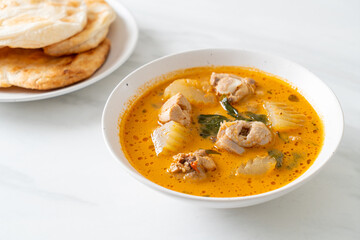 Chicken curry soup with roti