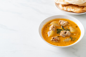 Chicken curry soup with roti