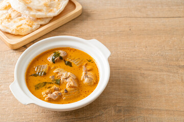 Chicken curry soup with roti