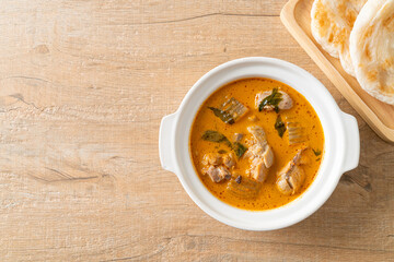 Chicken curry soup with roti