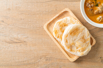 Chicken curry soup with roti