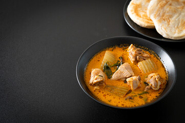 Chicken curry soup with roti