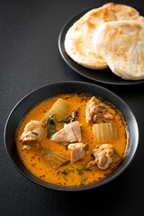 Chicken curry soup with roti
