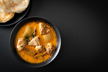 Chicken curry soup with roti