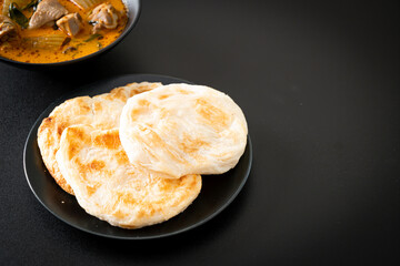 Chicken curry soup with roti