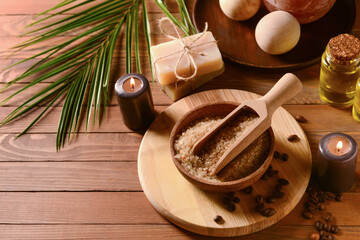 Spa composition with sea salt and burning candles on wooden background