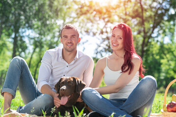 Couple with a dog in the park