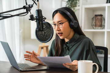 Woman use microphones wear headphones with laptop record podcast. Content creator concept.