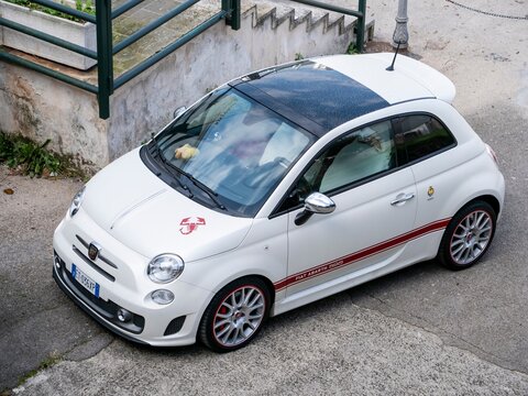 White sporty Fiat 500 Abarth 595 stylish retro hatchback typical for Italy